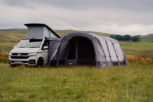 Vango Galli CC Air Inflatable Drive Away Awning - Low lifestyle image of awning attached to pop top VW van with front door open 